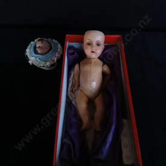 ANTIQUE BISQUE DOLL WITH GLASS EYES