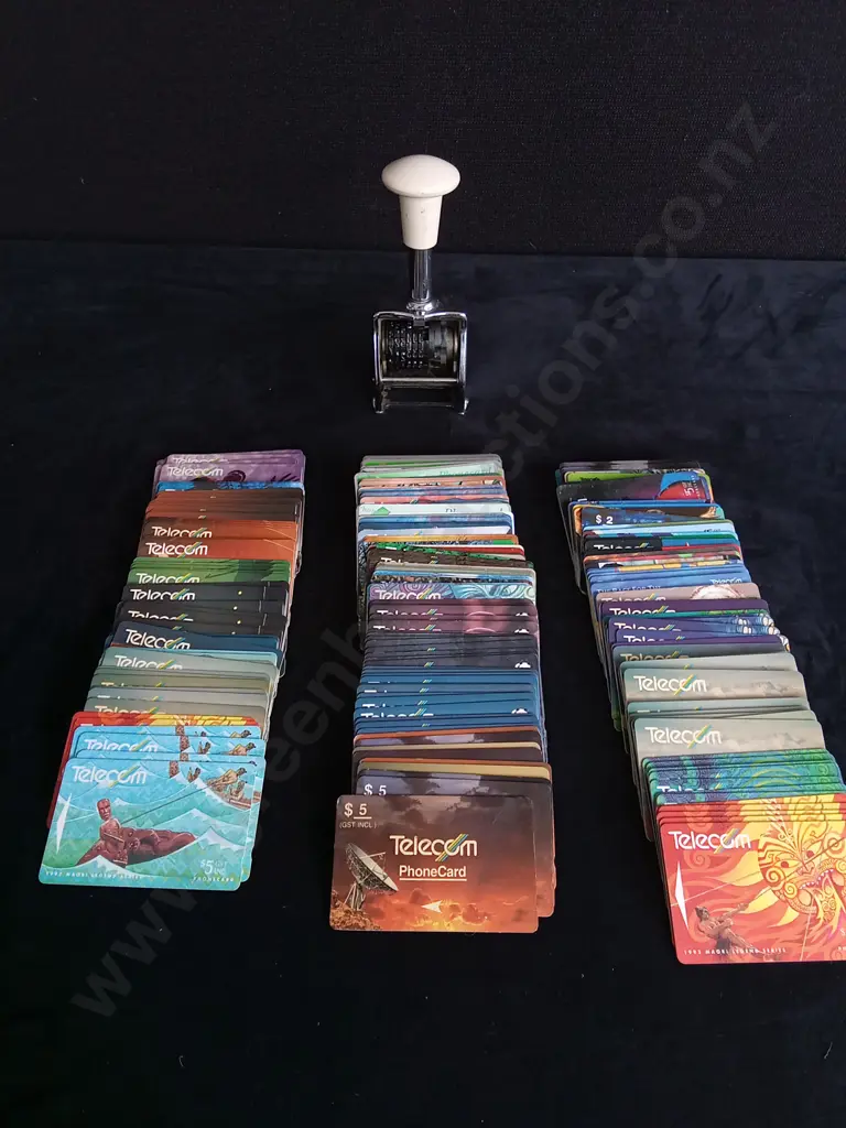 COLLECTION OF PHONE CARDS AND NUMBERING STAMP Image 1++