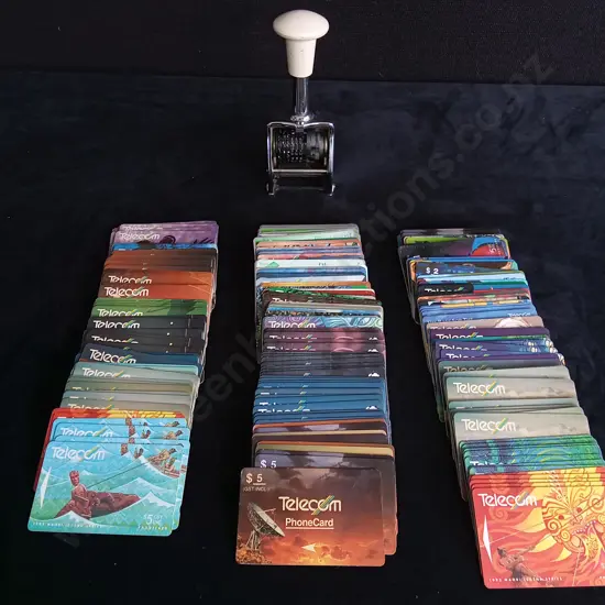 COLLECTION OF PHONE CARDS AND NUMBERING STAMP