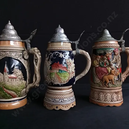 7 VINTAGE GERMAN STEINS, 2 ARE CLOCKWORK MUSICAL, ACTIVATED WHEN LIFTED