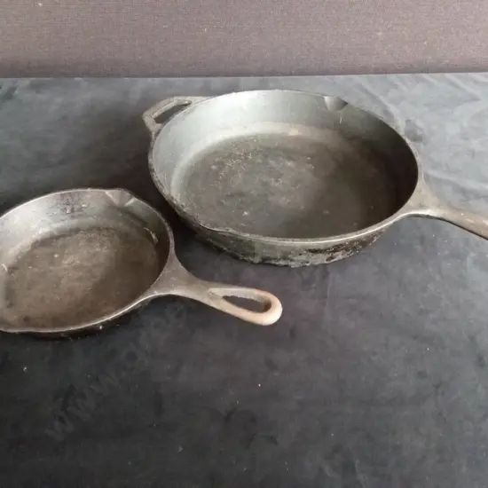 2 CAST IRON PANS