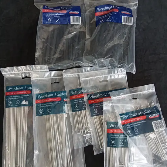 8 PIECES BRAND NEW WEEDMAT PINS AND STAPLES