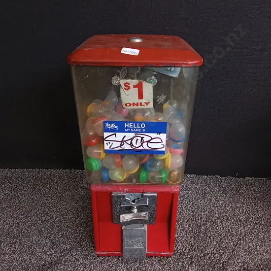 NORTHWESTERN SINGLE RED VENDING MACHINE COMPLETE WITH STOCK