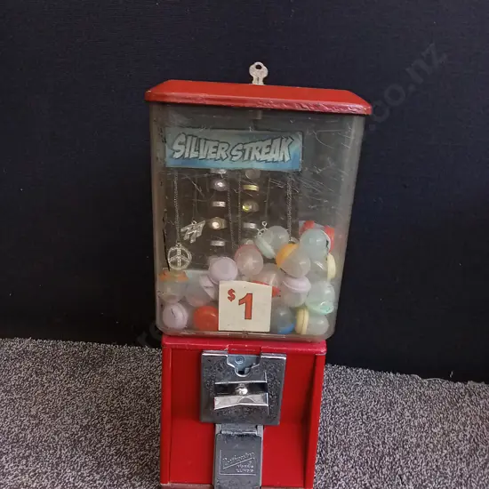NORTHWESTERN SINGLE RED VENDING MACHINE WITH STOCK