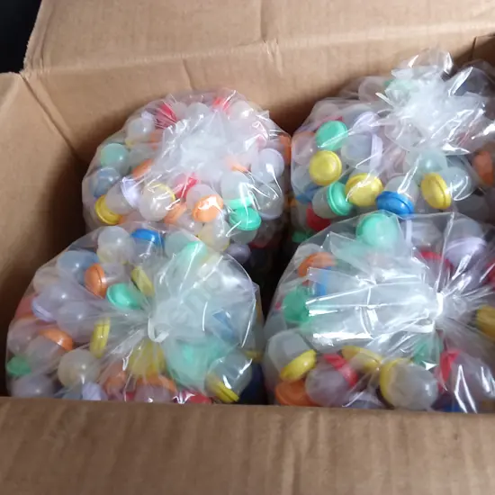 BOX OF PLASTIC CAPSULES FULL OF COSTUME JEWELLERY FOR VENDING MACHINE