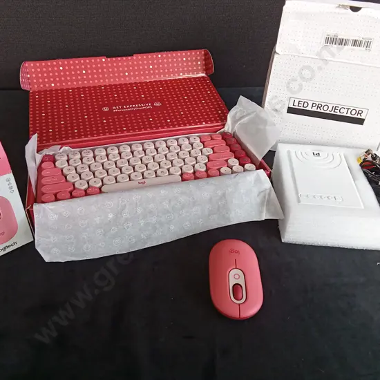 LOGITECH PINK MOUSE AND KEYBOARD WITH AN LED PROJECTOR