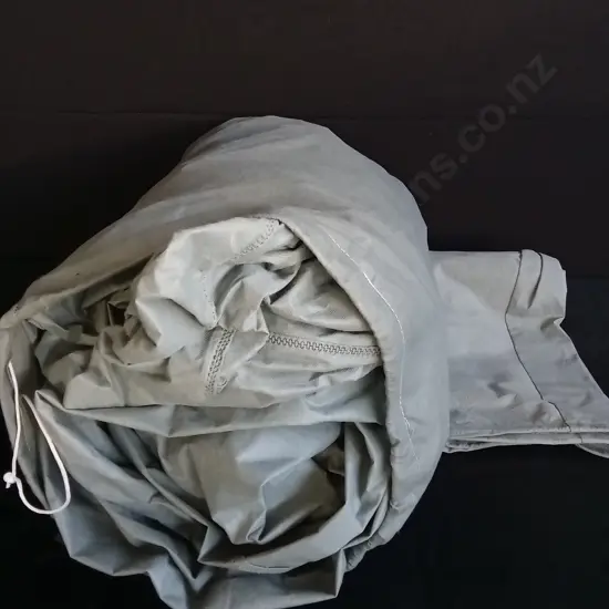 SACK OF MATERIAL POSSIBLY CAR COVER