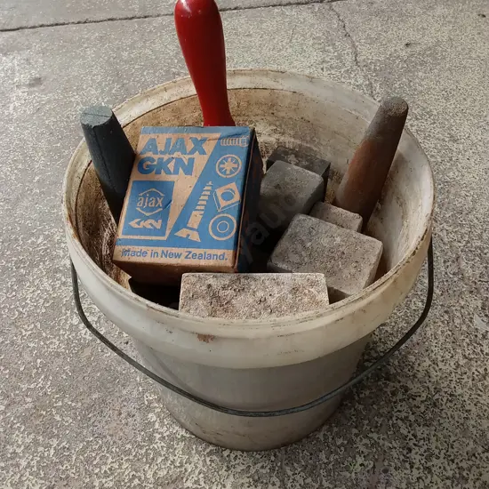 BUCKET OF CONCRETE BLOCKS AND TOOLS