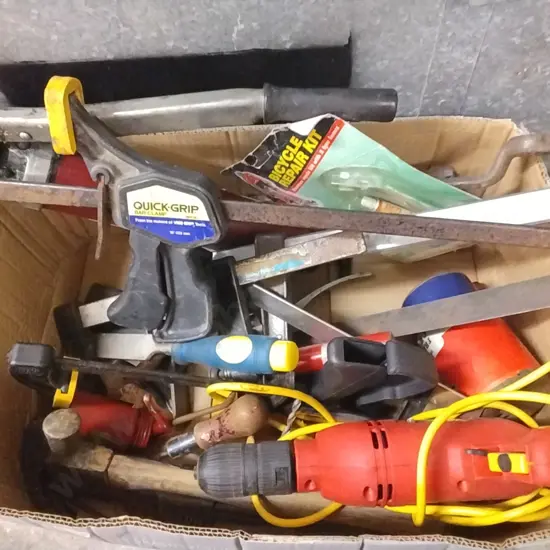 BOX OF TOOLS INCLUDING GREASE GUN, DRILL AND VARIOUS CLAMPS