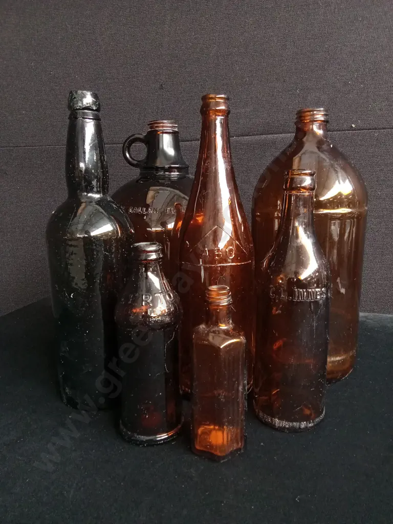 7 PIECES AMBER GLASS BOTTLES AND JUG Image 1++