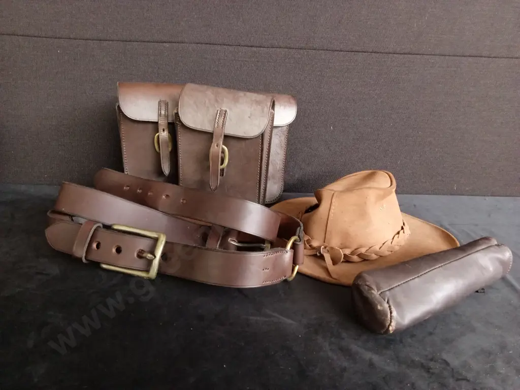 LEATHER HAT, 2 LEATHER BELTS, 3 SMALL LEATHER BAGS AND AN UMBRELLA Image 1++
