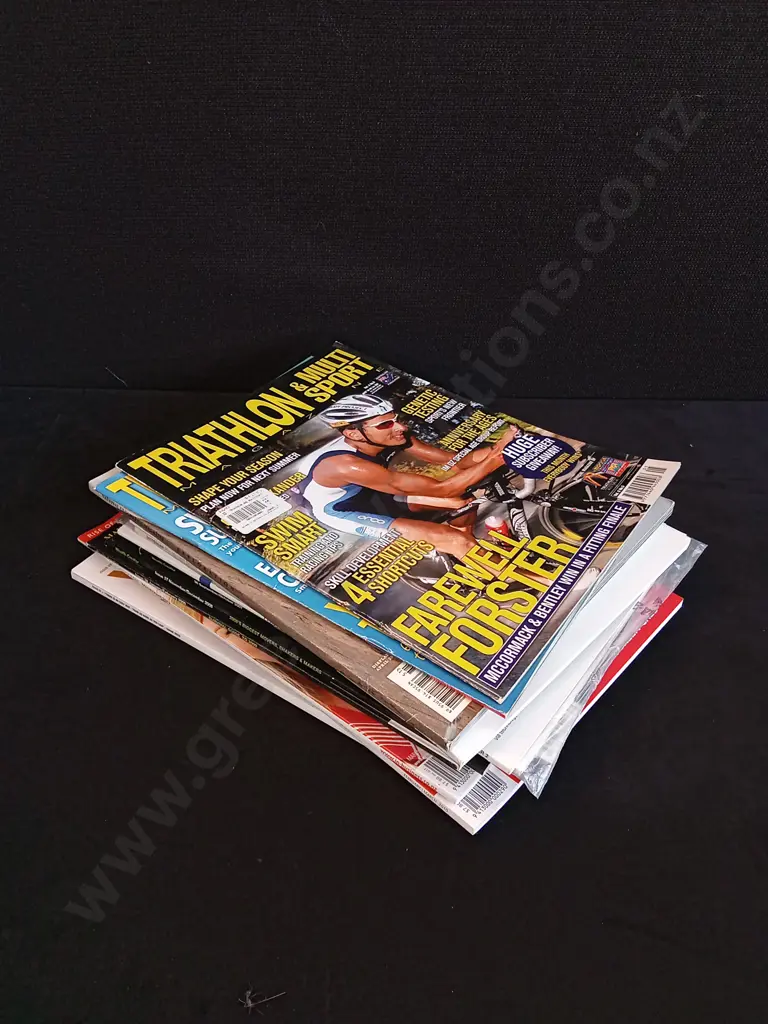 STACK OF SPORTS AND BUSINESS MAGAZINES Image 1++