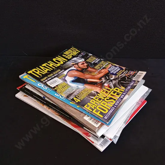 STACK OF SPORTS AND BUSINESS MAGAZINES
