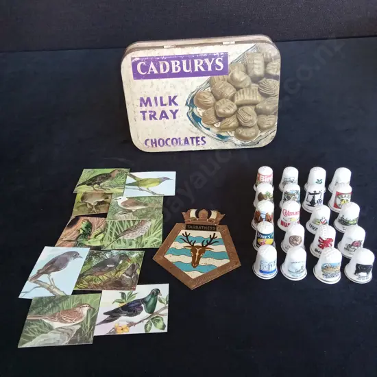 COLLECTION OF THIMBELS AND NZ BIRD CARDS IN A VINTAGE CADBURY TIN