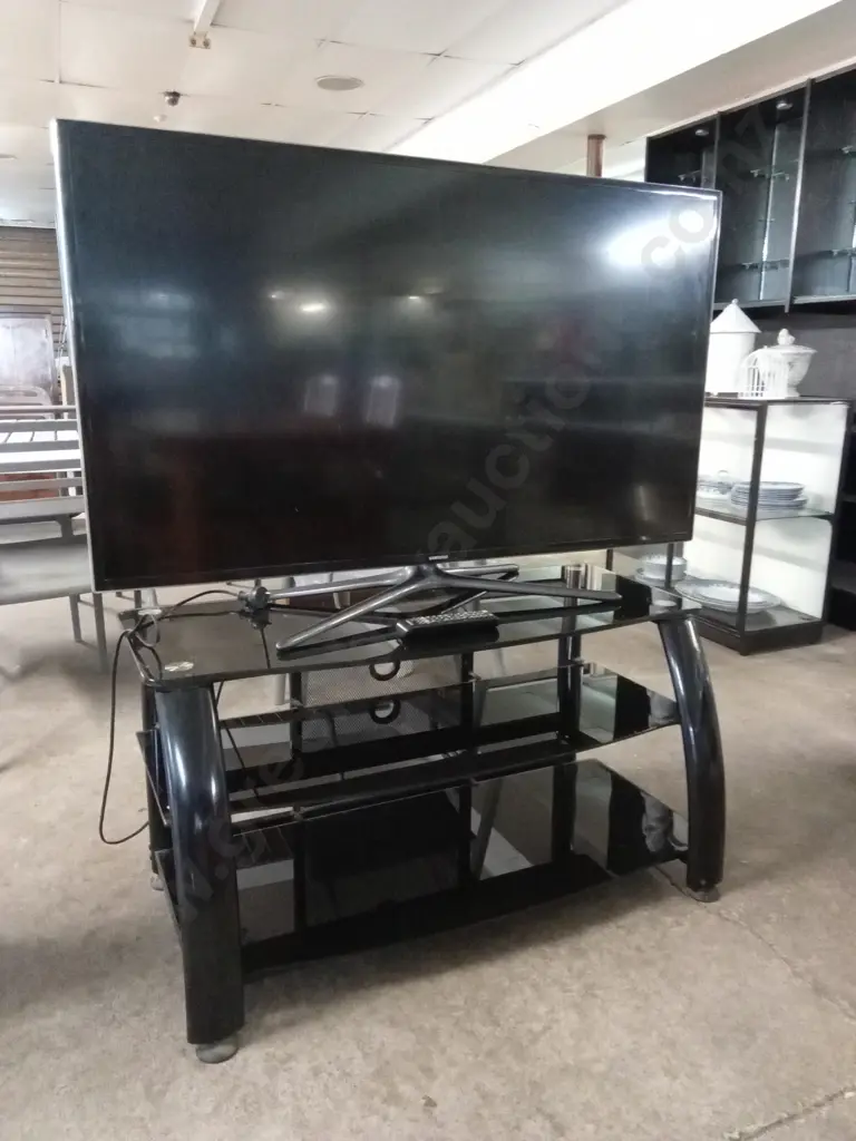 SAMSUNG 50 INCH LED TV MODEL UA50F6400 TESTED AND WORKING WITH REMOTE ON BLACK TV STAND Image 1++