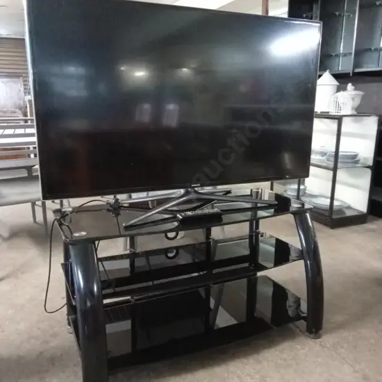 SAMSUNG 50 INCH LED TV MODEL UA50F6400 TESTED AND WORKING WITH REMOTE ON BLACK TV STAND