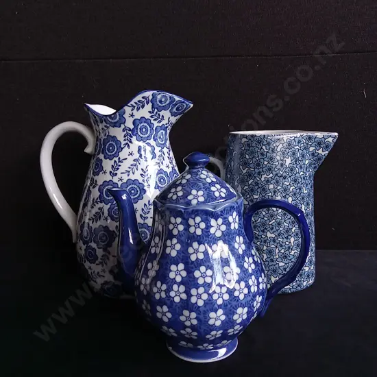 3 PIECES BLUE FLORAL JUGS AND TEA POT
