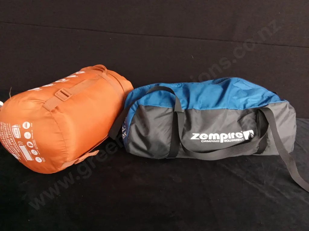 ZEMPIRE POCKET ROCKET SHOWER AND A SLEEPING BAG Image 1++