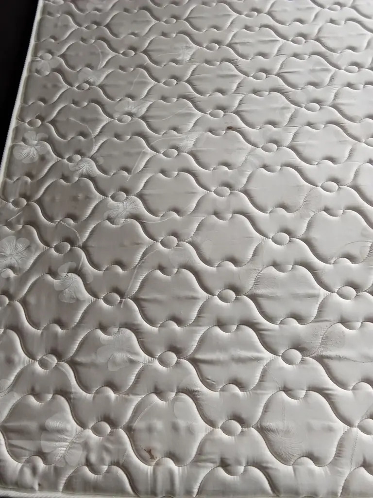 QUEEN BED BASE AND FREEMENT MATTRESS WITH 2 SMALL STAINS AS PICTURED Image 1++