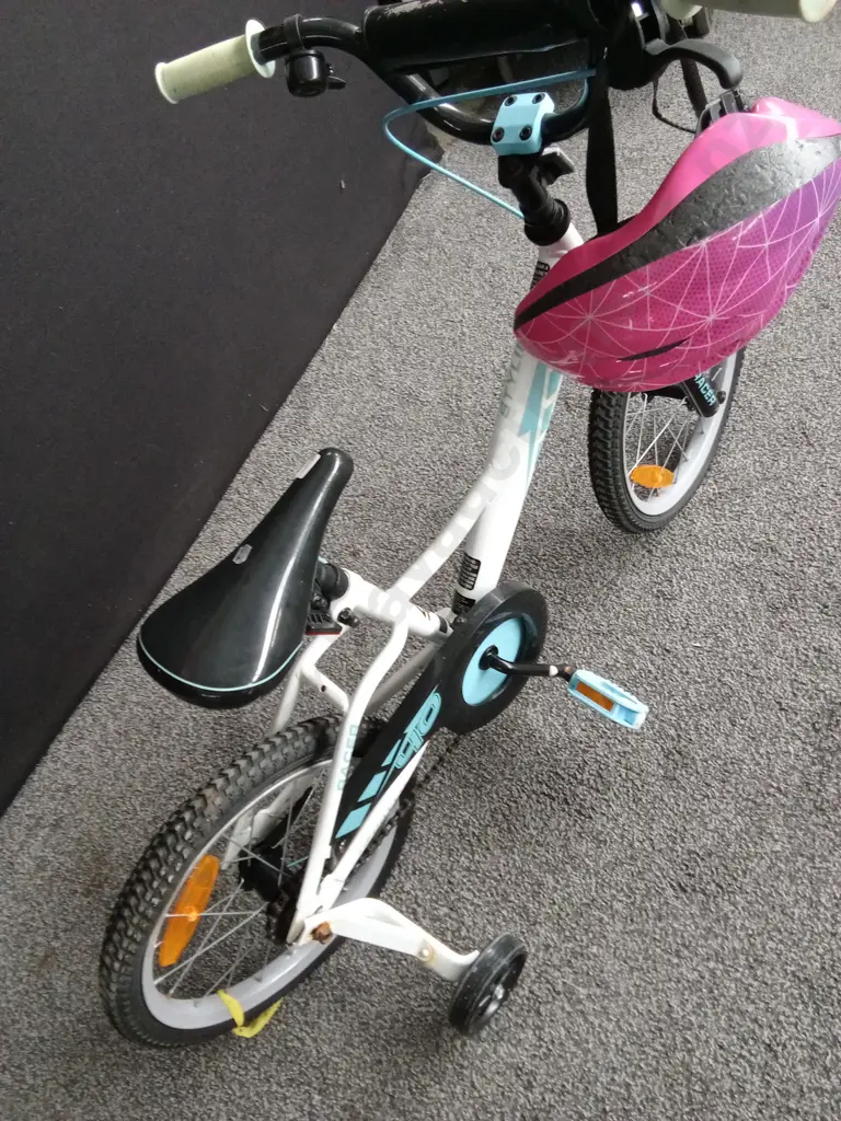 CHILDRENS BIKE WITH ONE TRAINING WHEEL AND A PINK HELMET Image 1++