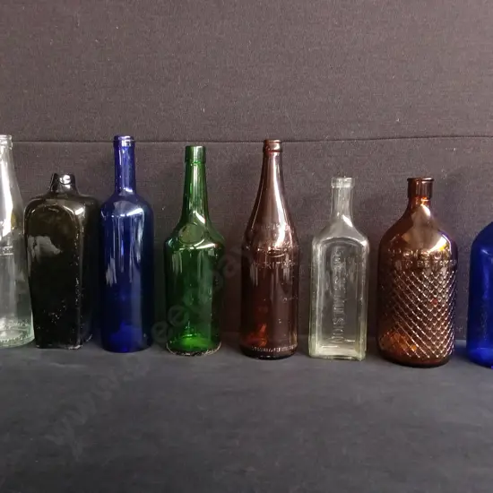 LOT OF 8 VINTAGE AND ANTIQUE LARGE GLASS BOTTLES, INCLUDING MEDICINAL, SPIRITS, SODA