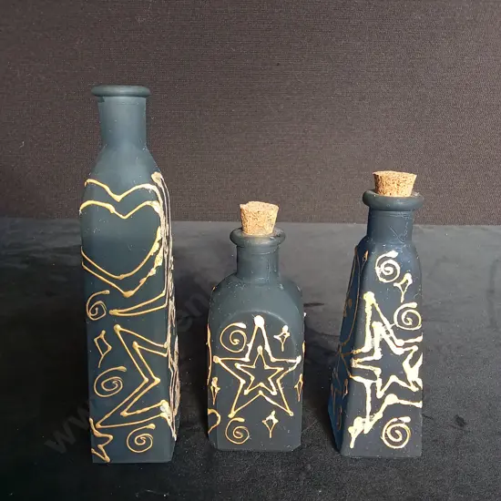 3 DECORATED GLASS BOTTLES