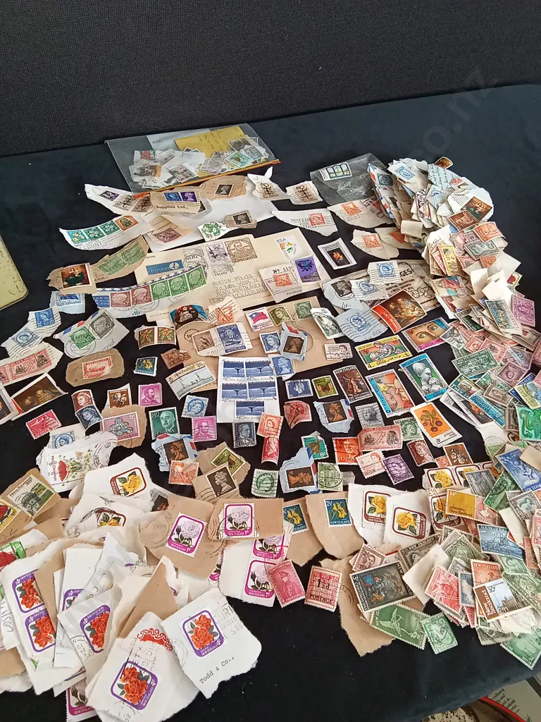 COLLECTION OF STAMPS IN A VINTAGE TIN Image 1++