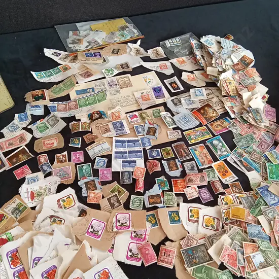 COLLECTION OF STAMPS IN A VINTAGE TIN