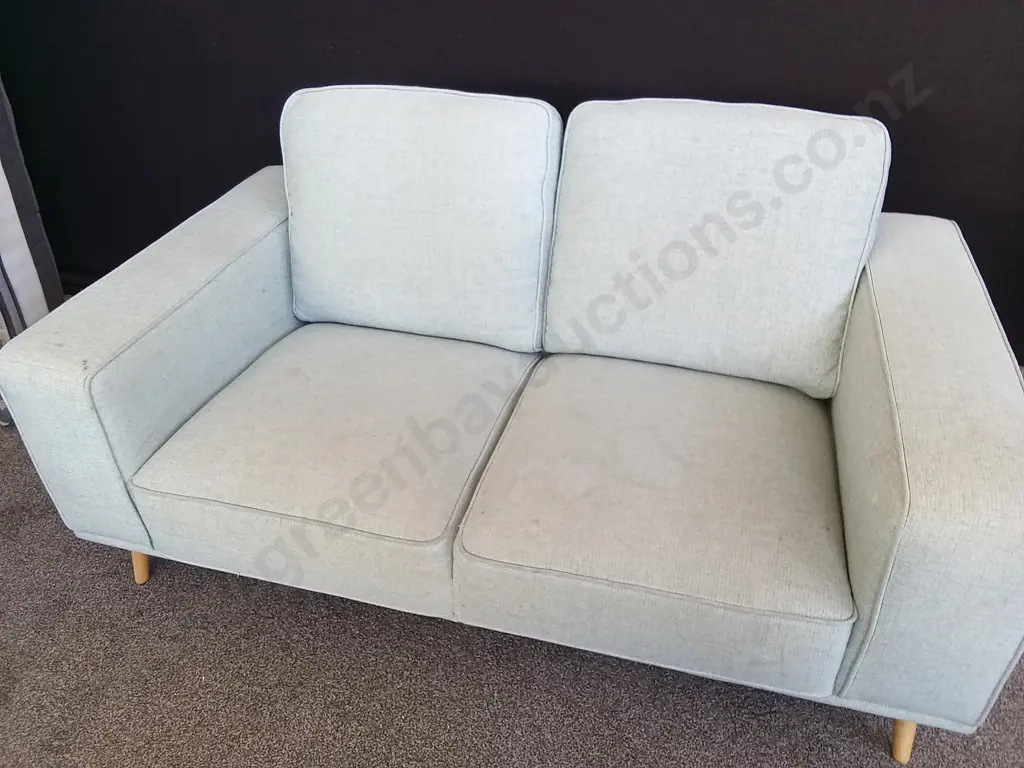 TWO SEATER BLUE FABRIC COUCH HAS A FEW STAINS AS SHOWN IN PHOTOS Image 1++