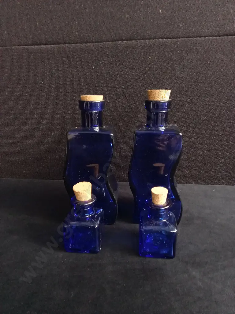 4 PIECES COBALT BLUE GLASS BOTTLES Image 1++