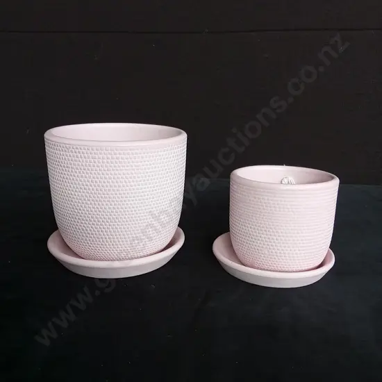 2 PINK PLANT POTS ON BASES