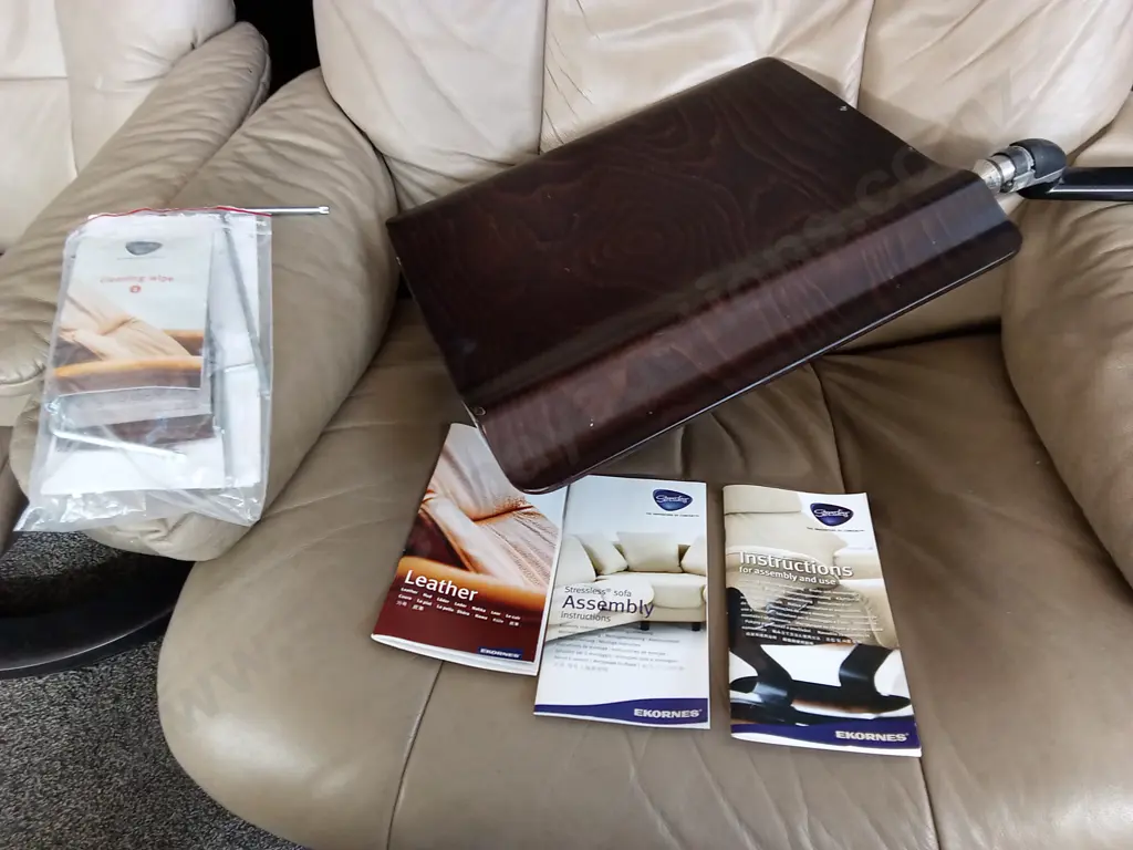 PAIR OF "STRESSLESS" BRAND RECLINING LEATHER SWIVEL ARMCHAIRS ONE WITH A MOVEABLE TABLE ATTATCHED Image 1++