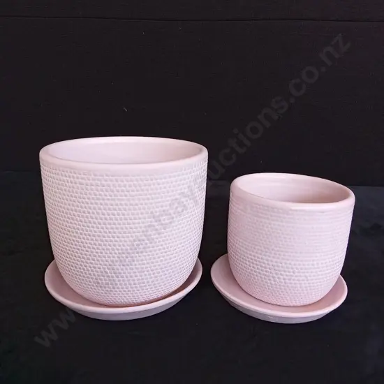 2 PINK PLANT POTS ON BASES TALLEST 13.5CM