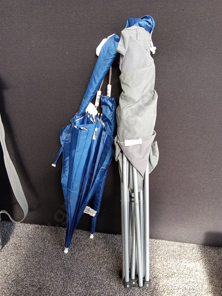 TRAVEL COT ON WEELS AND A CAMPING CHSIR WITH CLIP ON UMBRELLAS Image 1++