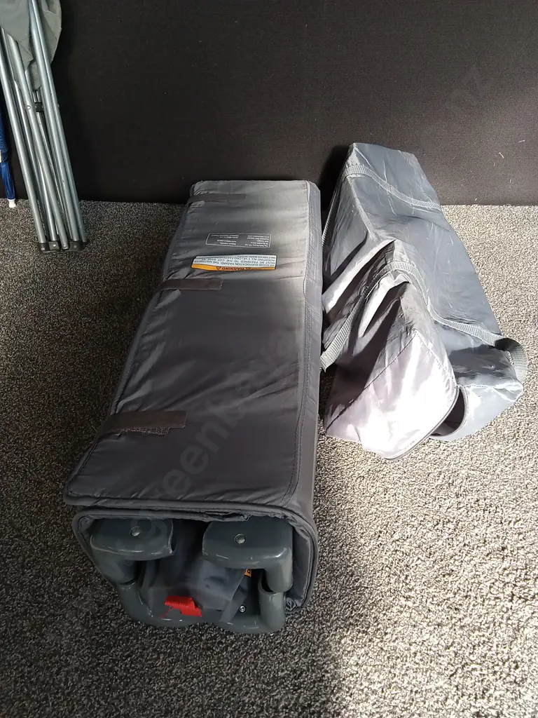 TRAVEL COT ON WEELS AND A CAMPING CHSIR WITH CLIP ON UMBRELLAS Image 1++