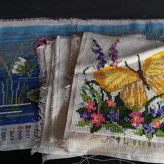 COLLECTION OF CROSS-STITCHED CANVASES, LARGEST W 86 CM