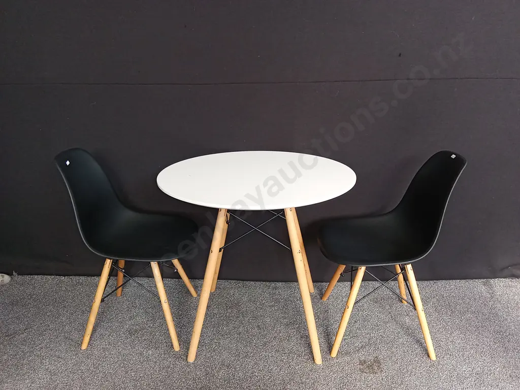 3 PIECE DINING SET FEATURING A WHITE ROUND TABLE AND 2 TWO BLACK PLASTIC CHAIRS WITH WOODEN LEGS Image 1++