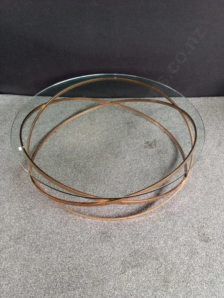 GLASS TOP COFFEE TABLE WITH GOLD COLOURED METAL FRAME WITH INTERLOCKING RINGS, 110CM DIA, H 33CM Image 1++