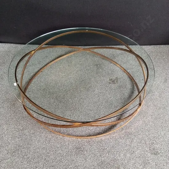 GLASS TOP COFFEE TABLE WITH GOLD COLOURED METAL FRAME WITH INTERLOCKING RINGS, 110CM DIA, H 33CM