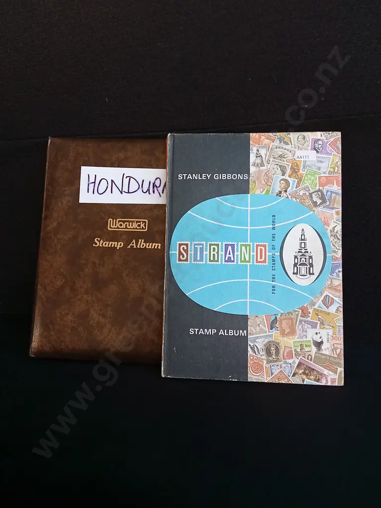 PAIR OF STAMP ALBUMS Image 1++