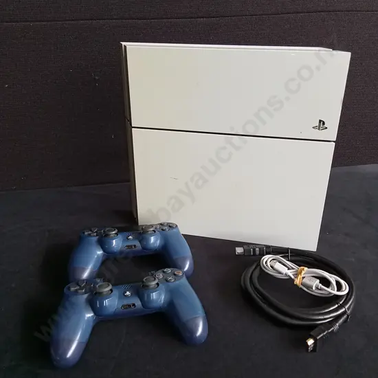 PLAYSTATION 4 AND TWO CONTROLLERS