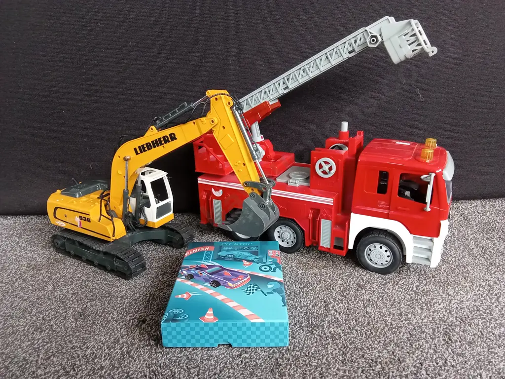 COLLECTION OF VEHICLE MODELS, FIRETRUCK, EXCAVATOR AND PIT STOP CARD SET, FIRETRUCK IS 48CM LONG Image 1++