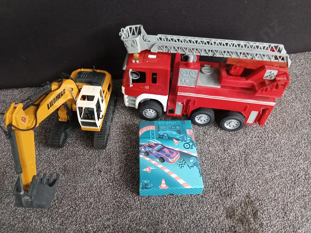 COLLECTION OF VEHICLE MODELS, FIRETRUCK, EXCAVATOR AND PIT STOP CARD SET, FIRETRUCK IS 48CM LONG Image 1++