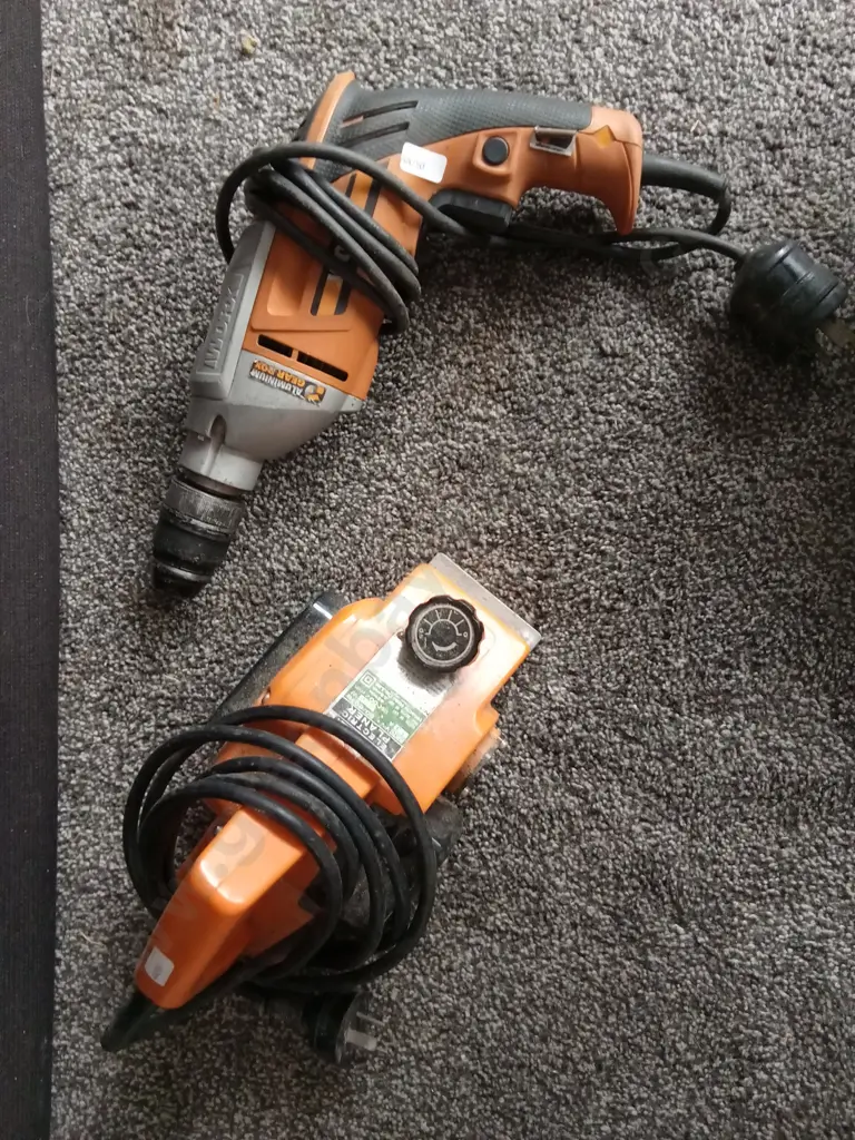 PAIR OF TOOLS, ELECTRIC PLANER AND DRILL Image 1++