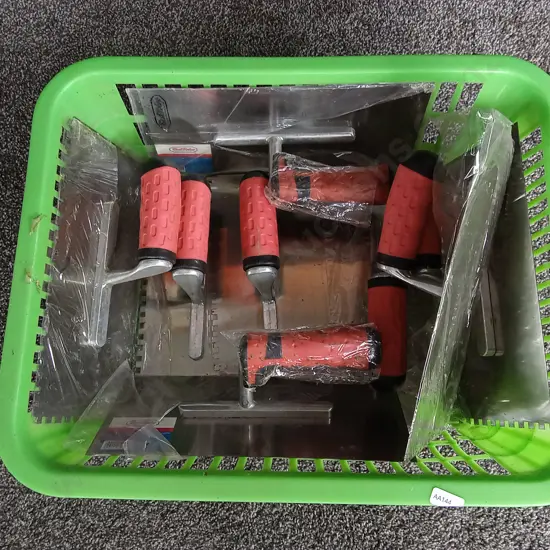 BASKET OF PLASTER TROWELS