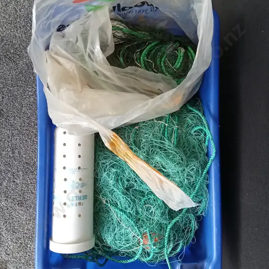 BOX OF FISHING NETS AND A BERLEY CONTAINER