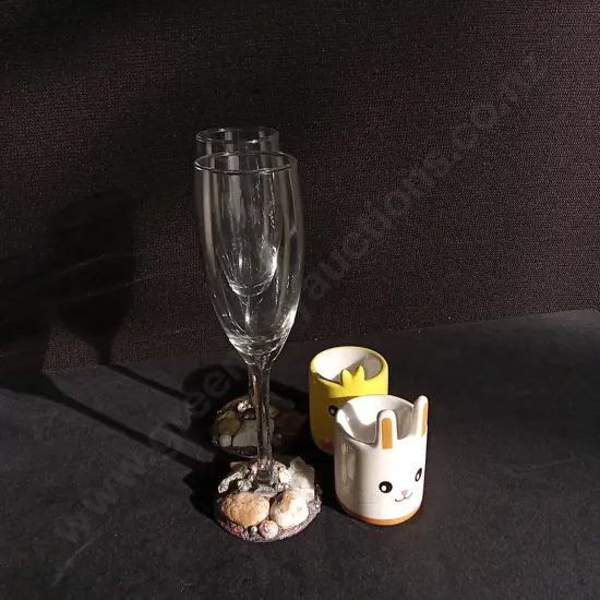 4 PIECES CHAMPAGNE FLUTES AND EGG CUPS, TALLEST H 22 CM