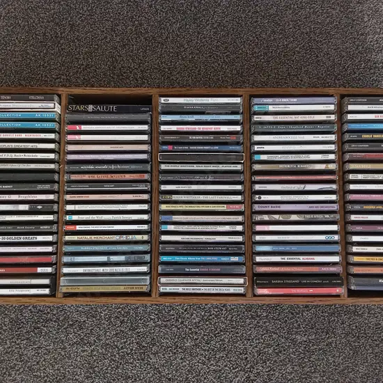 MIX OF CDS IN WOODEN ORGANISER
