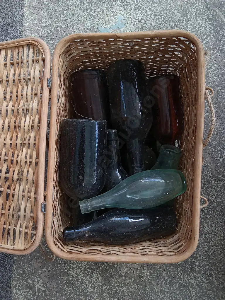 WICKER BASKET FULL OF VINTAGE GLASS BOTLLES, H 33 CM X W 41 CM Image 1++