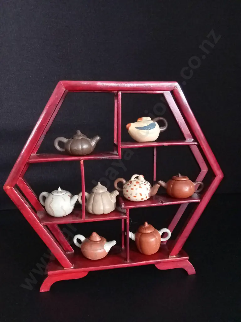 HEXAGONAL WOODEN SHELF H26CM , 2 BROKEN PIECES, WITH 8 MINIATURE TEA POTS TALLEST H3CM Image 1++